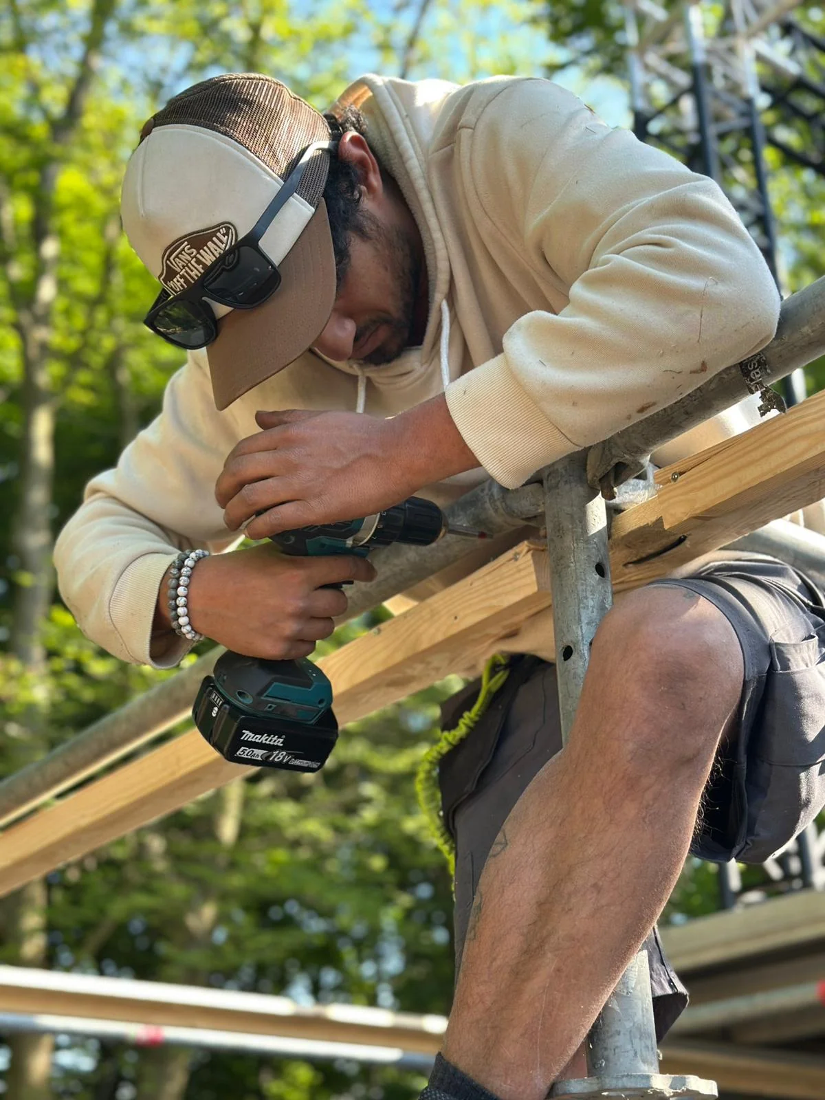 Technical crew member assembling stage scaffolding