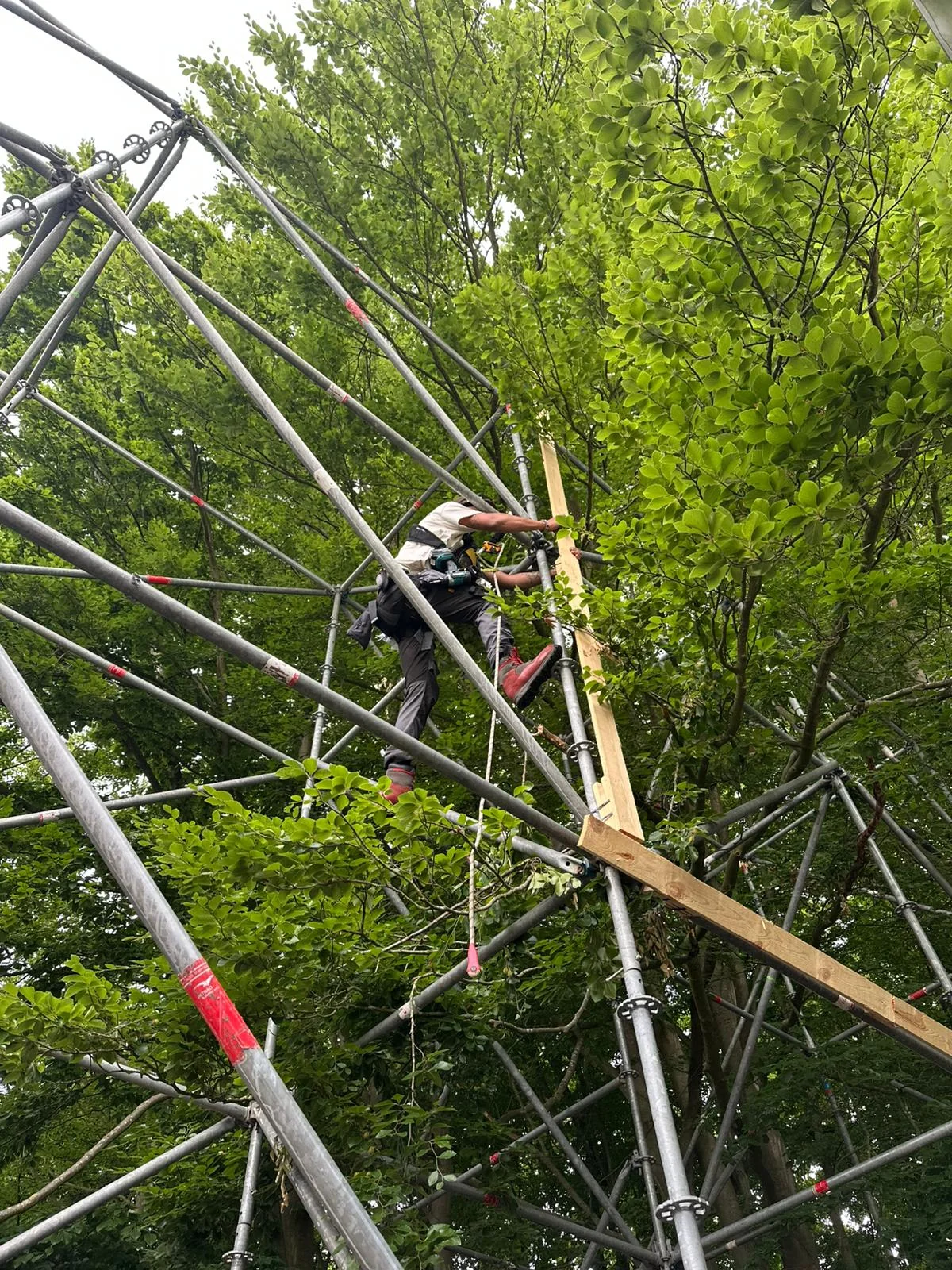 Professional stagehand working on a stage frame